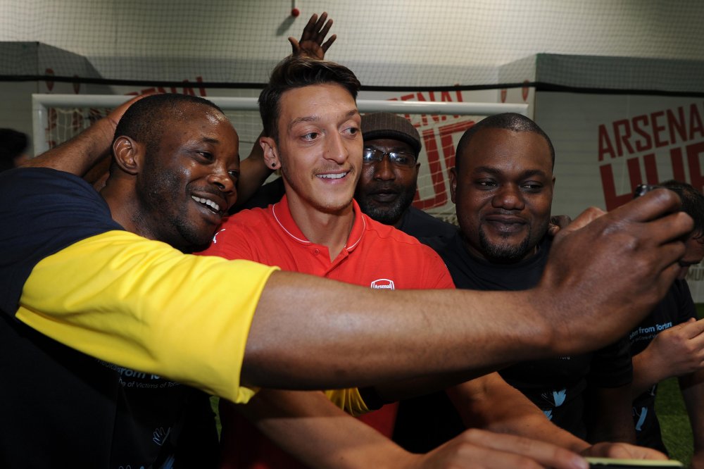 Ozil with members of the Football Therapy Group