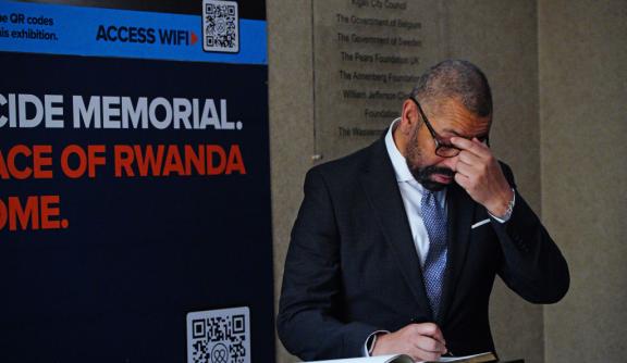 James Cleverly with his head in his hands
