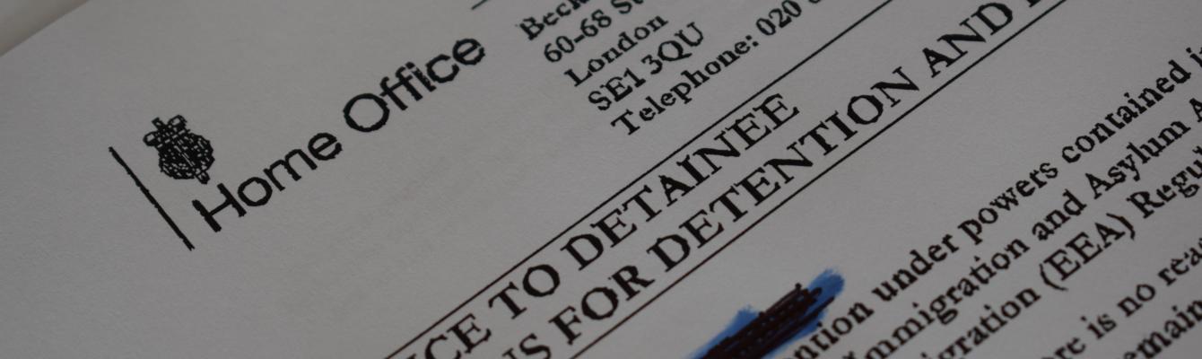 Home Office paperwork showing a decision to detain a person