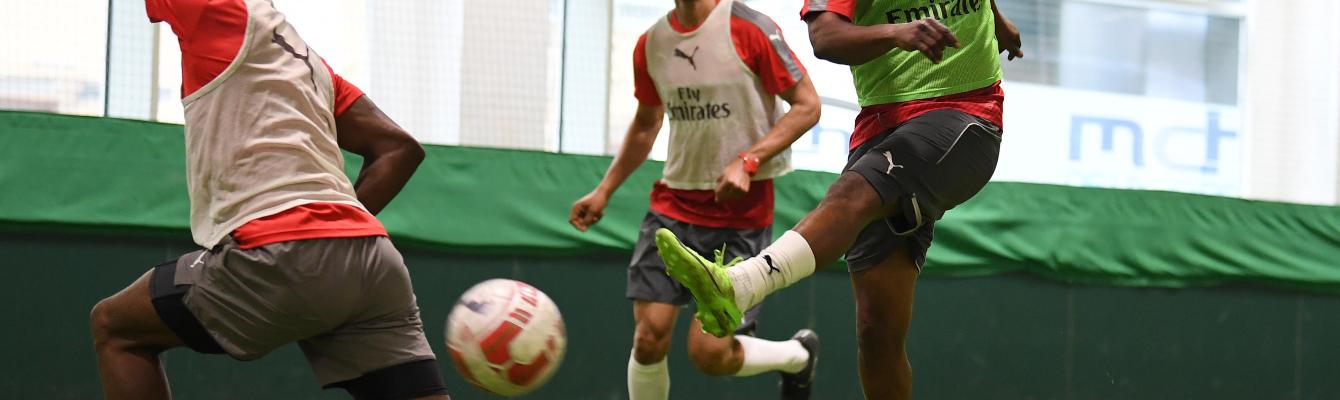 Members of the football group playing at Arsenal's training ground