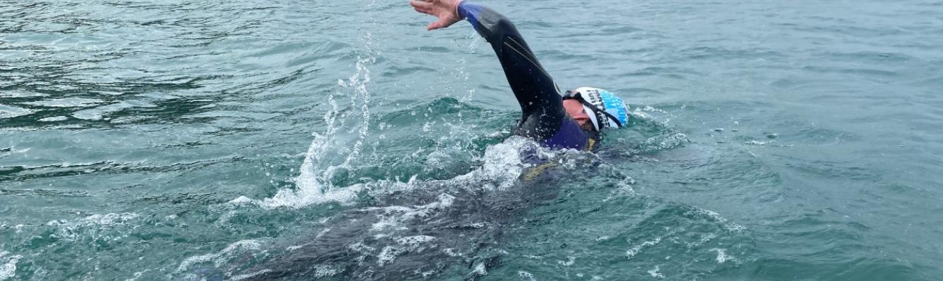 Person swimming for fundraising event 