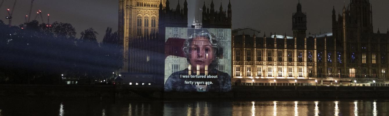 Video of survivor projected onto Houses of Parliament