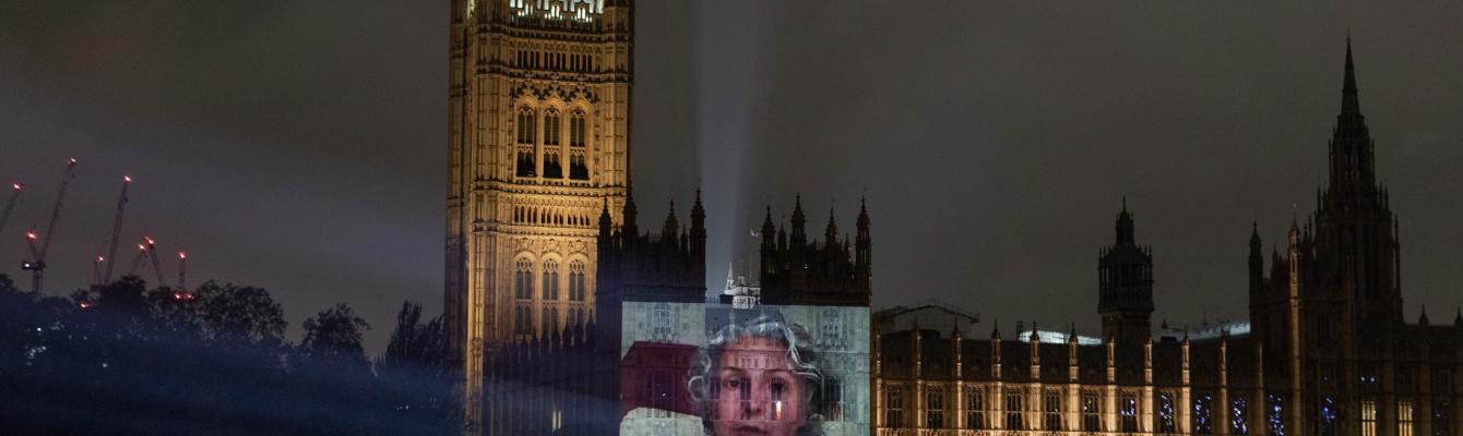 Video of survivor projected onto Houses of Parliament