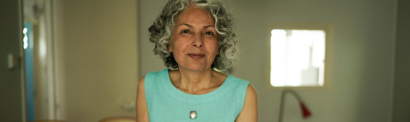 Middle aged woman smiling at camera