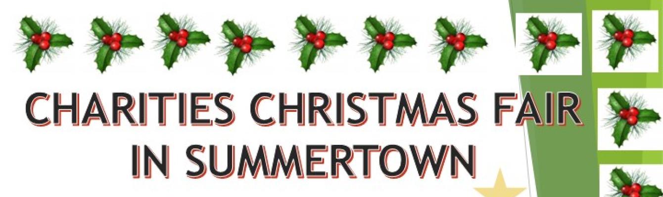 charities Christmas fair in summertown surrounded by xmas trees