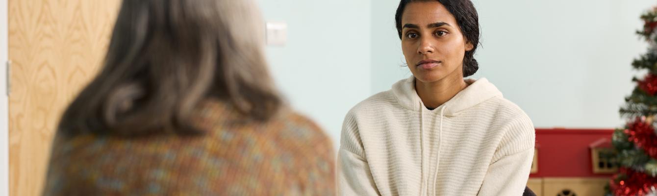 Camera is focused on young Sri Lankan woman in a therapy session