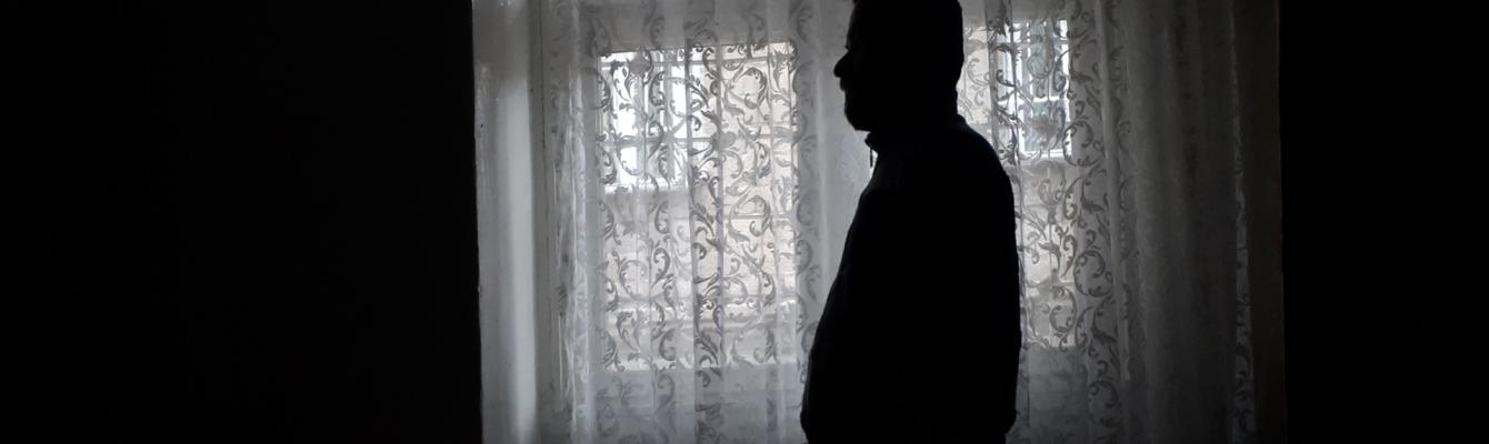 Shadow of a man by a window