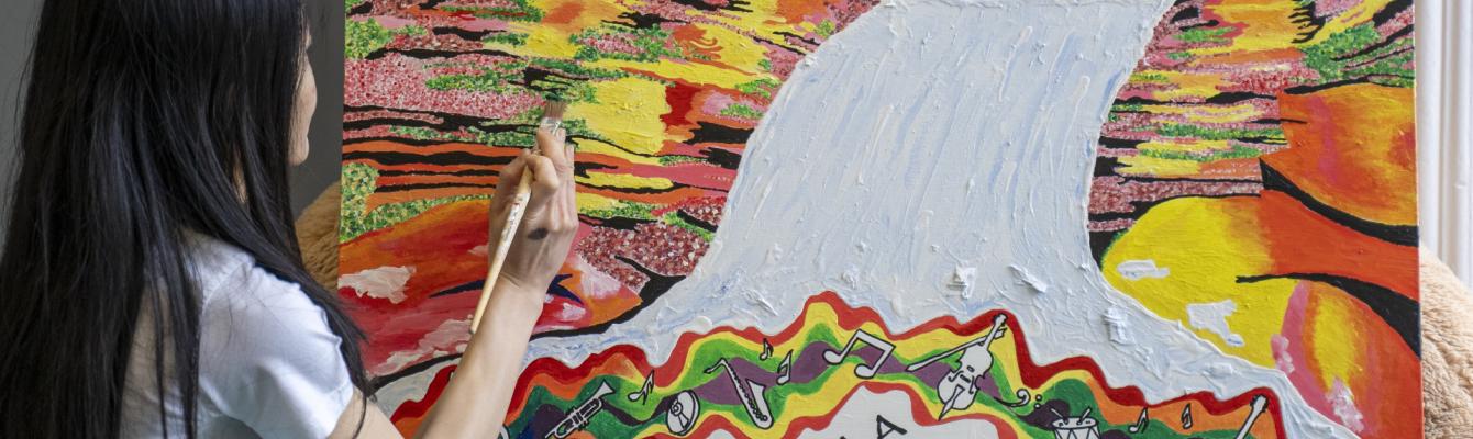 Young woman, back of her head, painting