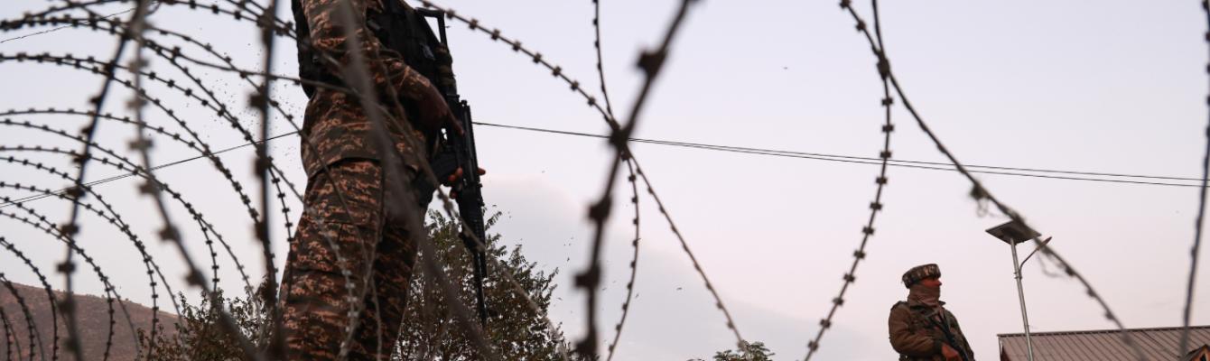 Barbed wire and soldiers