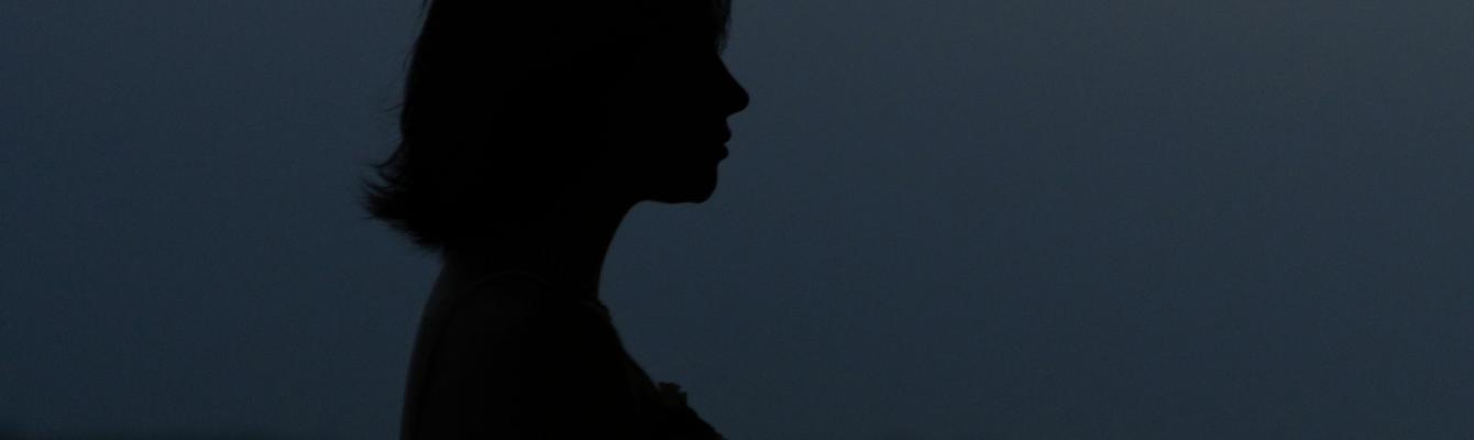 Silhoutte of a woman in a field