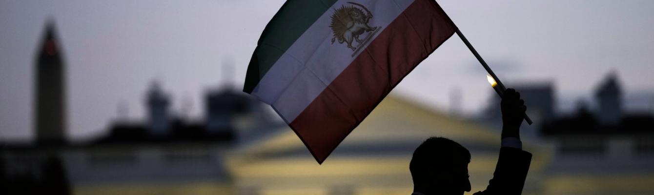 Iranian Lion and Sun flag being held up