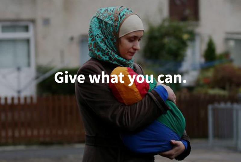 Woman with her child, and a message saying 'Give what you can.'