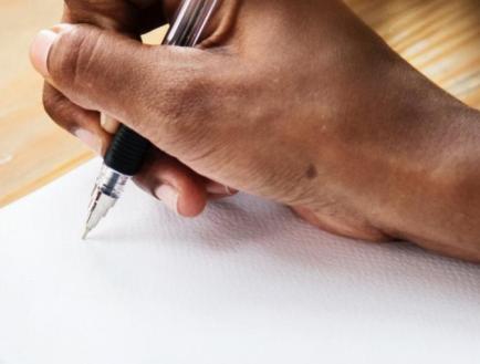 Image of someone writing