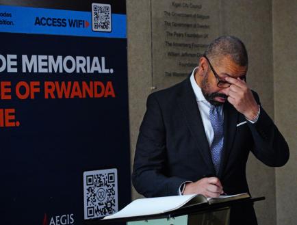 James Cleverly with his head in his hands