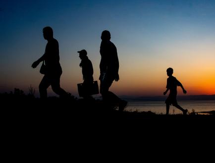Silhoutte of a group of people walking