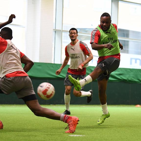 Members of the football group playing at Arsenal's training ground