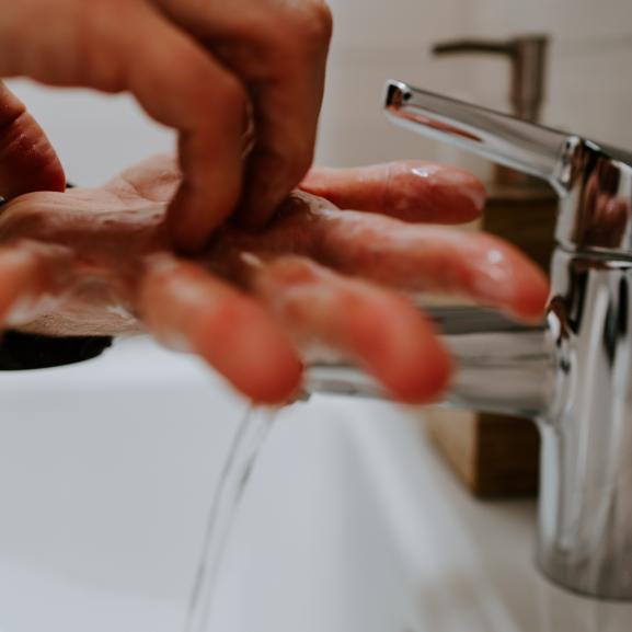 Man washing his hands