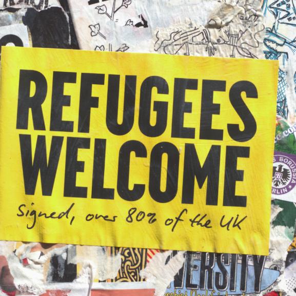 Poster on a wall that says 'Refugees Welcome'