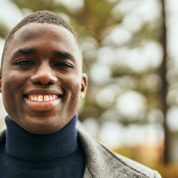 Young man smiling at camera