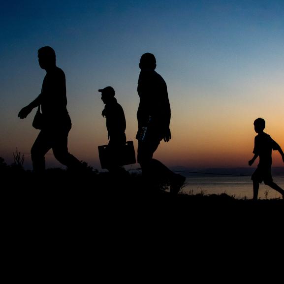 Silhoutte of a group of people walking