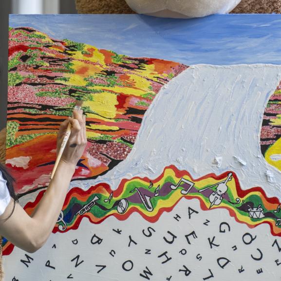 Young woman, back of her head, painting