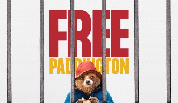Paddington Bear behind bars graphic with the words FREE PADDINGTON behind.