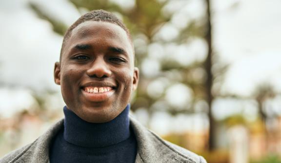 Young man smiling at camera