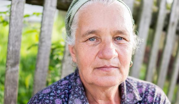 Older Eastern European woman looking into camera