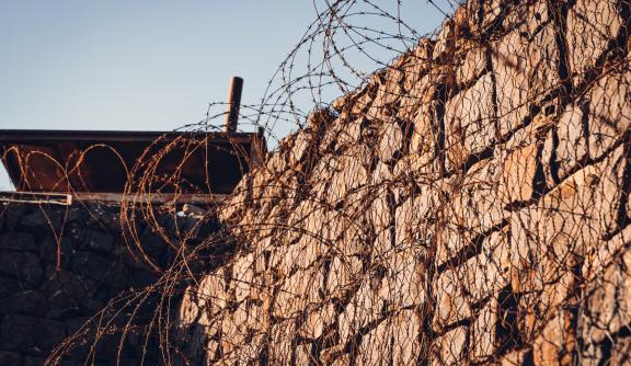 Barbed wire and wall