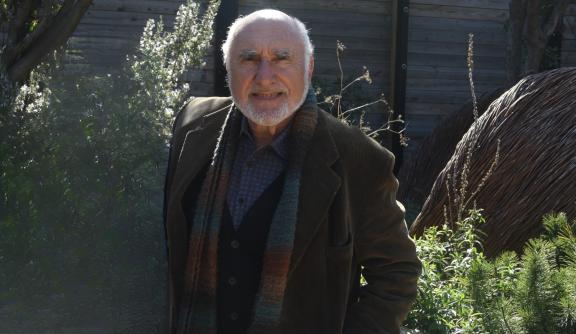 Older man smiling at camera