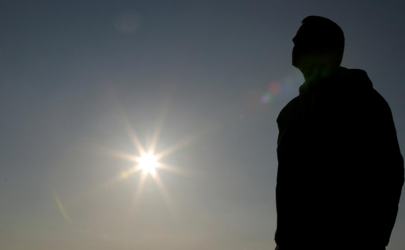 Silhoutte of a man standing outside