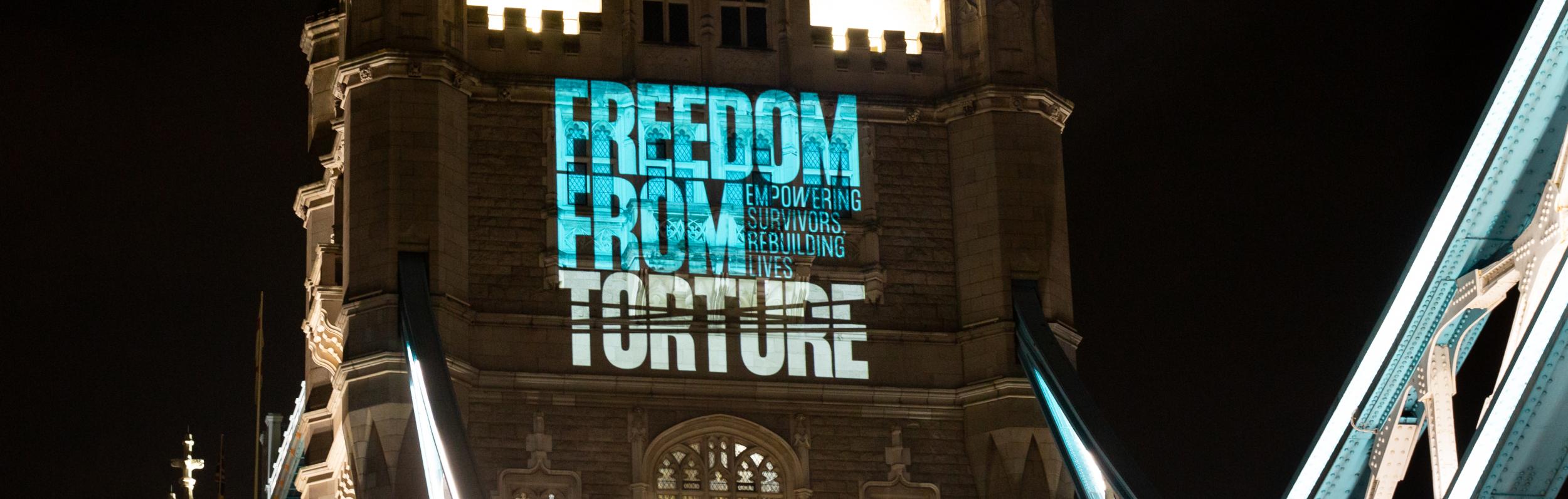 Projection on Tower Bridge with Freedom from Torture logo